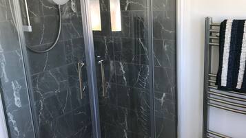 Combined shower/tub, hair dryer, towels, soap