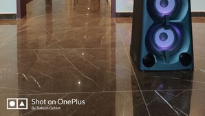 A hallway with a polished marble floor, a large black Sony speaker, and a wall-mounted artwork of horses. - Hotel The Balam (Luni)