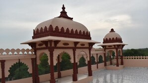 A traditional structure with domed roofs and ornate arches, likely part of a historical building. - Hotel The Balam (Luni)