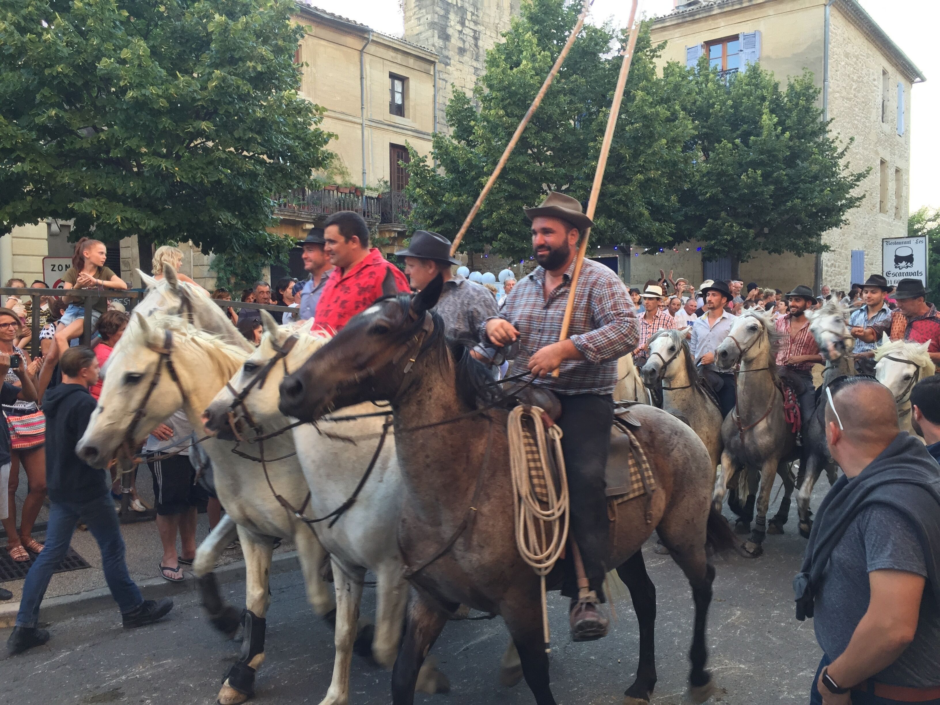 A group of people riding horses in a parade.