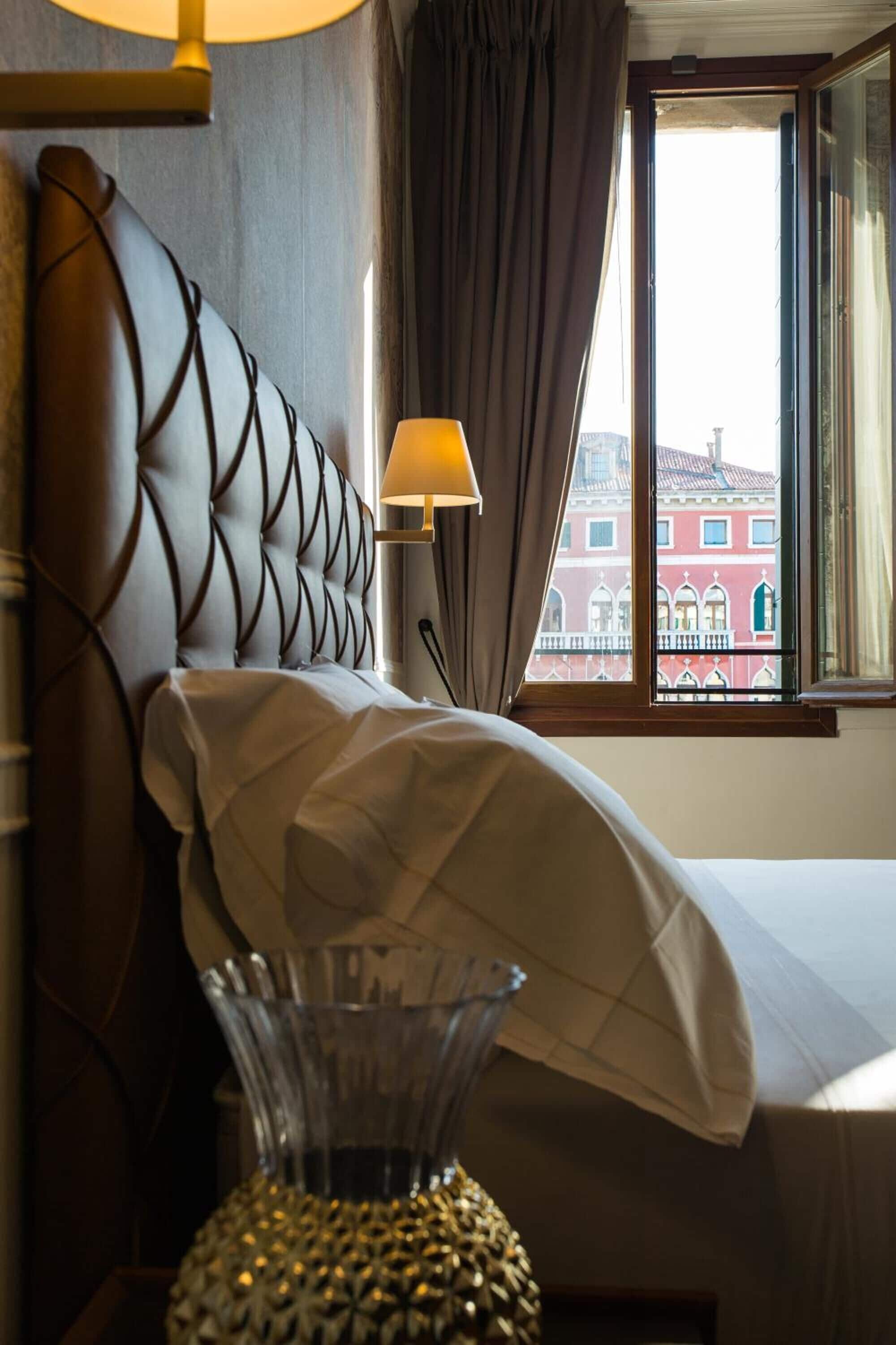 grand deluxe canal view | frette italian sheets, premium bedding, down duvets, select comfort beds