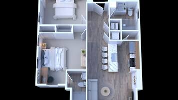 A two-bedroom apartment layout with a living area, kitchen, and bathroom.