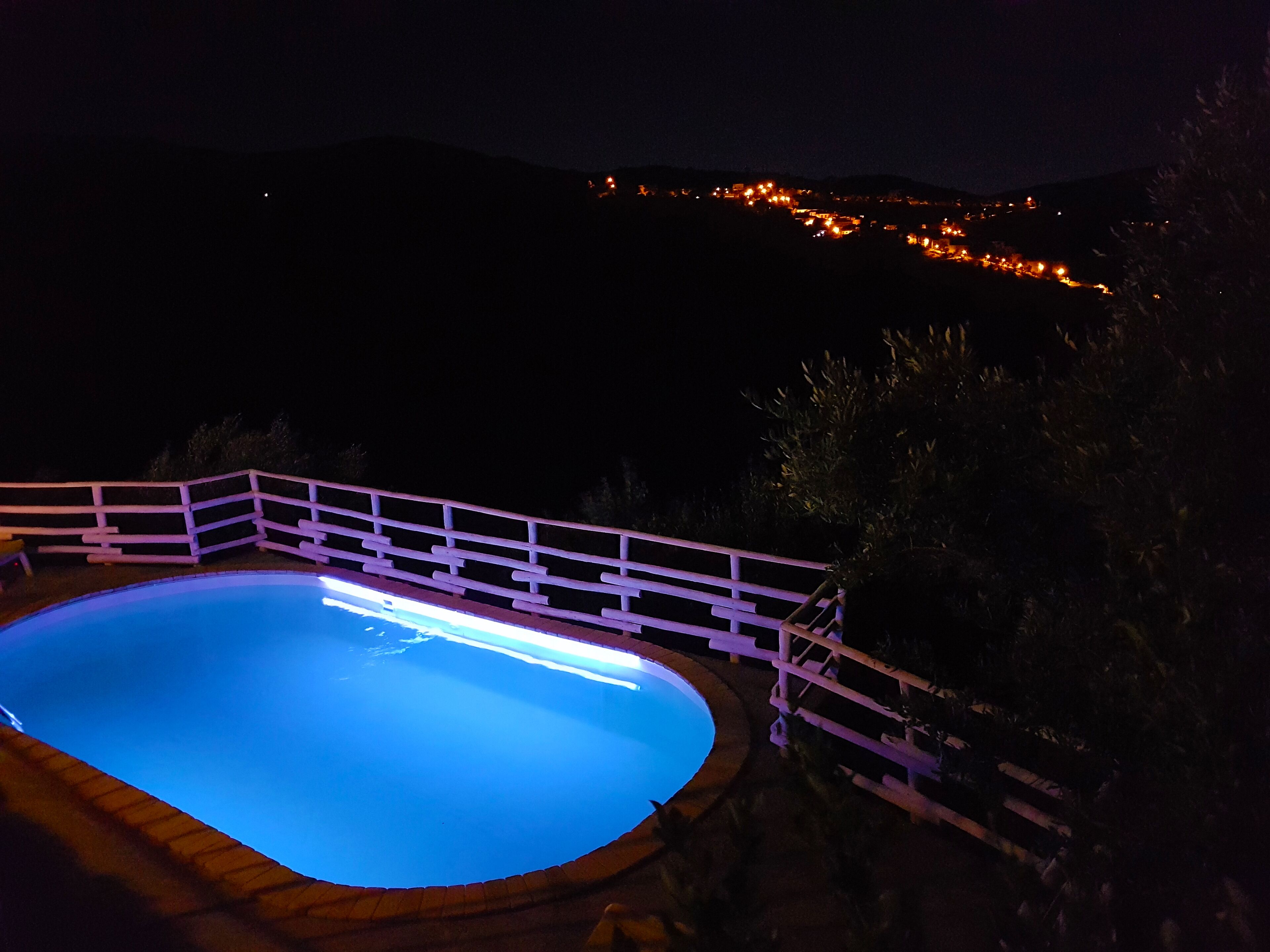 Private panoramic swimming pool at night