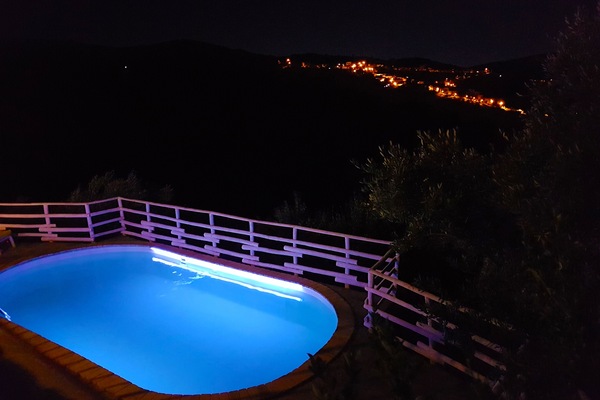 Private panoramic swimming pool at night