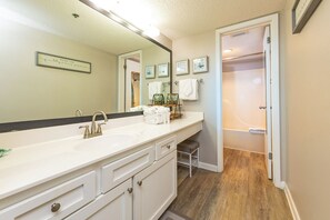A bathroom with a white sink, a mirror, and a towel rack. - Panoramic Views! - Phoenix VII 7513 (Orange Beach)