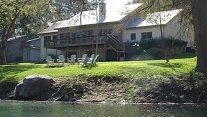 A two-story building with a covered patio area.