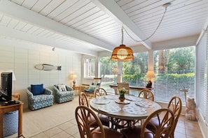 Cozy living area with a round dining table and comfortable seating for relaxation.