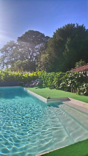 Outdoor pool, pool umbrellas, pool loungers