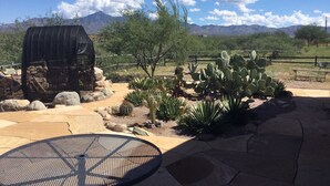 A patio with a grill, cactus plants, and a view of mountains. - Tranquil Retreat with Gorgeous near 360-degree Mountain Views! (Rio Rico)