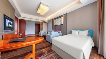 Suite familiar | 1 dormitorio, ropa de cama de alta calidad, minibar y caja fuerte