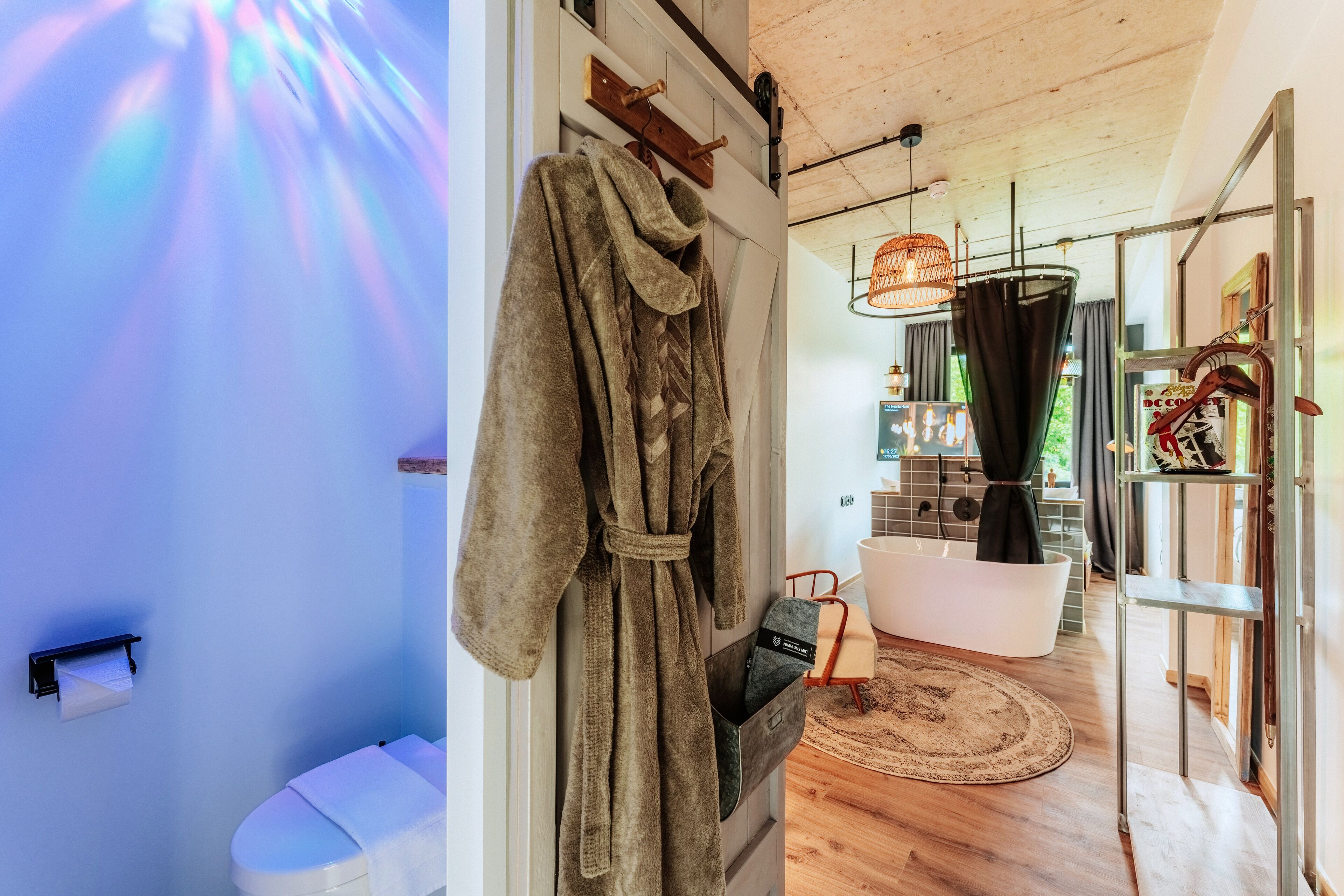 A bathroom with a bathtub, a shower, and a toilet.