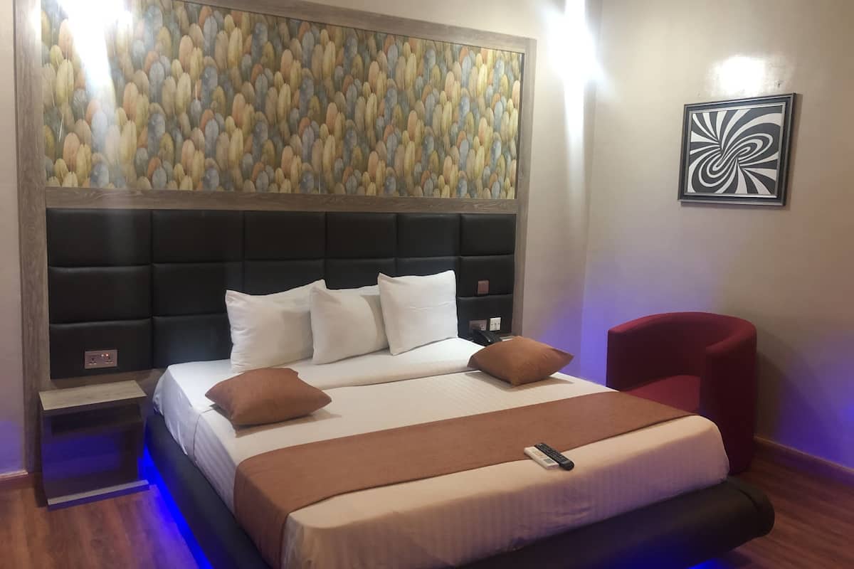 Desk, laptop workspace, bed sheets