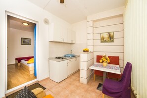 Studio Apartment with Mountain View | Living area | Flat-screen TV