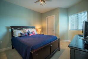 A bedroom with a bed, a desk, a ceiling fan, a window with blinds, and a door. - I'll Have A Side Of Beach With My Morning Coffee! Directly On The Sand!!! (Biloxi)