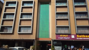 A building with two sections labeled "KASTURI" and "INTERNATIONAL".