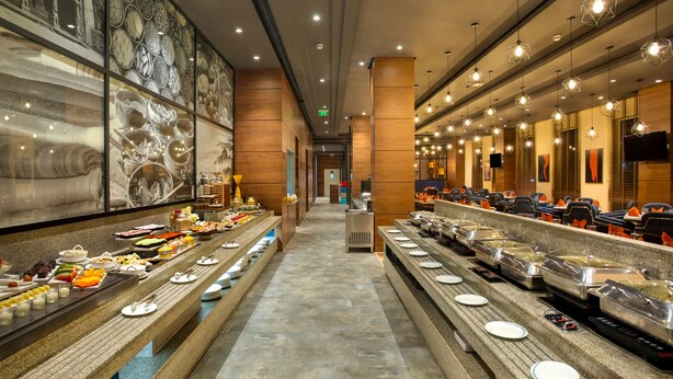 A buffet setup with multiple food stations and seating areas.