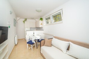 Apartment, 2 Bedrooms, Terrace, Garden View | Living area | TV - Apartment Stipan (Brela)