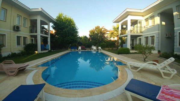 Outdoor pool, pool umbrellas, pool loungers