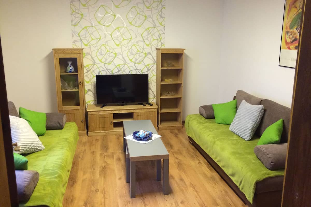 Family Apartment | Living room | 40-inch flat-screen TV with satellite channels, TV