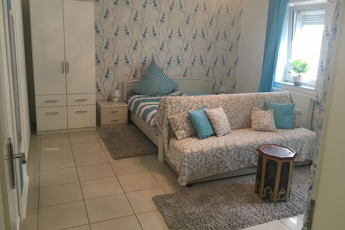 Design Apartment | Living area | 40-inch flat-screen TV with satellite channels, TV