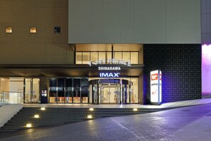 The exterior of the T. Joy Prince Shinagawa IMAX cinema with a modern facade and a large IMAX logo. - Shinagawa Prince Hotel East Tower (Tokyo)