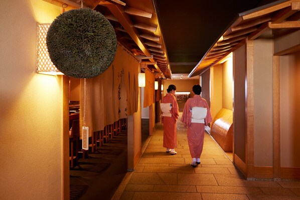 A corridor with wooden paneling and a hanging decorative ball. - Shinagawa Prince Hotel N Tower (Tokyo)