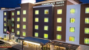 A multi-story hotel with a modern design, featuring a covered entrance and multiple windows. - TownePlace Suites By Marriott Las Vegas Stadium District (Las Vegas)