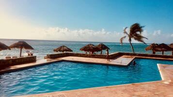 Outdoor pool, pool umbrellas, sun loungers