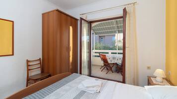 Standard Apartment | Blackout drapes, iron/ironing board, free WiFi, bed sheets