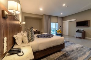 Habitación ejecutiva | Escritorio, wifi gratis y ropa de cama 