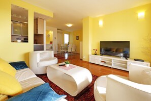 Luxury Apartment, 3 Bedrooms | Living area | 72-inch flat-screen TV with cable channels, Smart TV