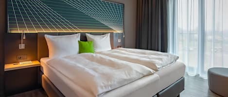 Hypo-allergenic bedding available, in-room safe, desk, laptop workspace