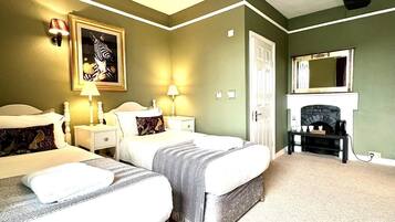 Deluxe Room, Ensuite, Courtyard View | Individually decorated, individually furnished, desk, iron/ironing board