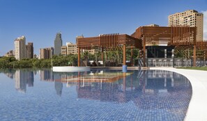 A modern pool area with a clear view of surrounding high-rise buildings. - Sunset Drive Mar Holidays (Benidorm)