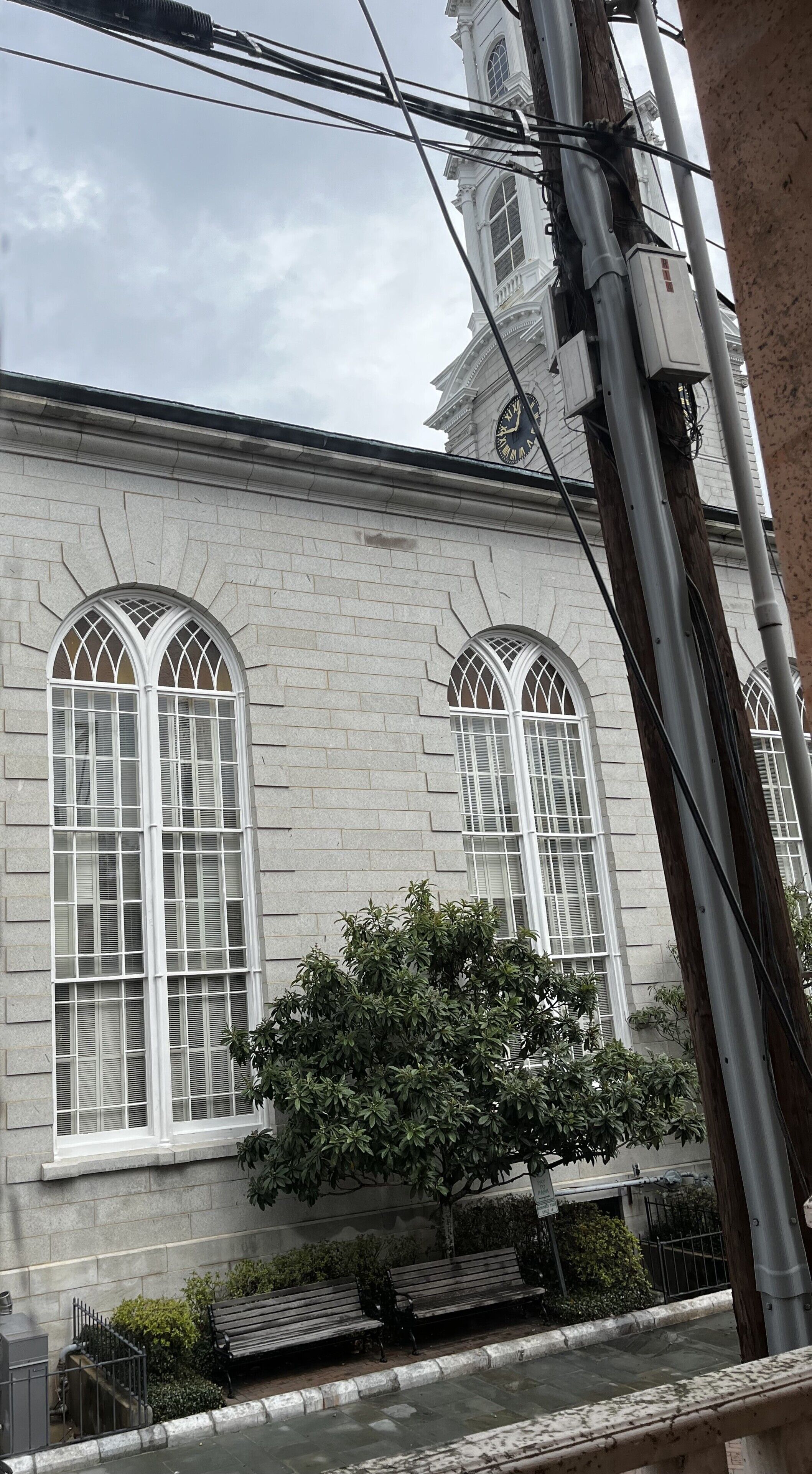 A building with arched windows and a clock tower.