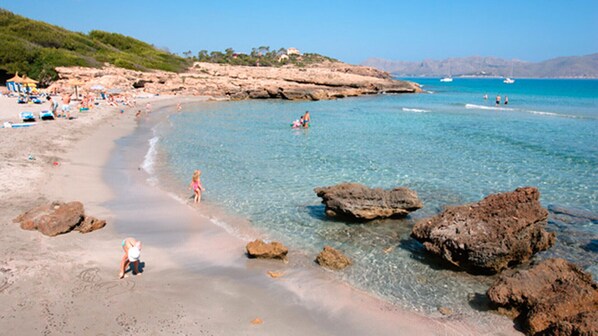 On the beach, sun-loungers, beach towels