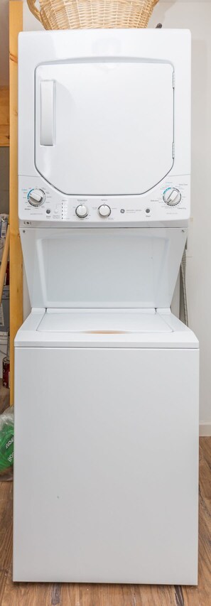A white front-loading washing machine with control panel and door.