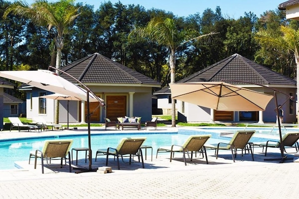 Outdoor pool, pool umbrellas, sun loungers
