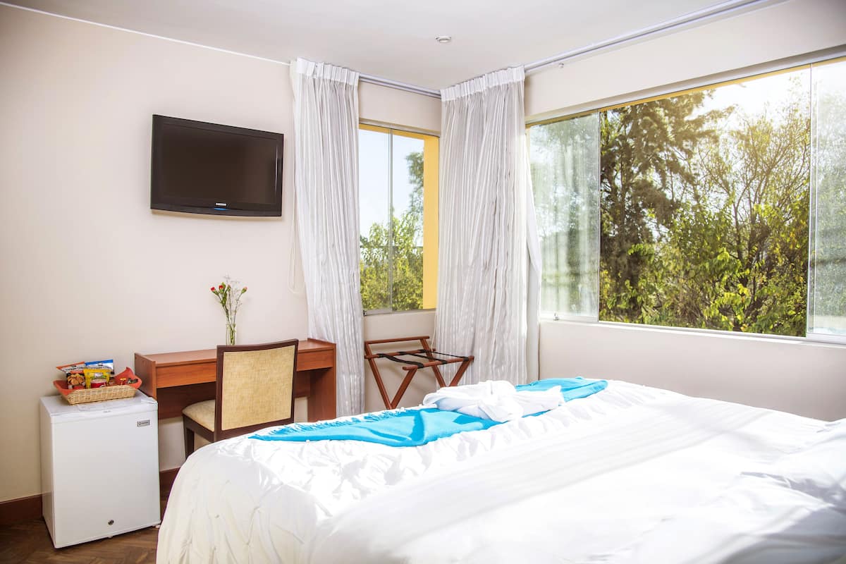 Premium bedding, down duvets, in-room safe, desk