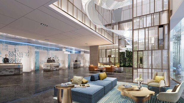 A spacious lobby with a reception desk, seating area, and large windows. - Radisson Suzhou (Suzhou)