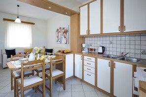 Comfort Apartment, Sea View | Private kitchen | Full-size fridge, oven, stovetop, coffee/tea maker
