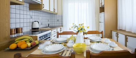Comfort Apartment, Sea View | Private kitchen | Full-sized fridge, oven, stovetop, coffee/tea maker