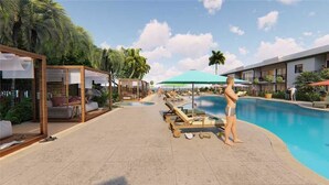 A poolside area with lounge chairs, umbrellas, and a pool. - Deluxe King Gulf View Rm 104 Apartment 1 (Holmes Beach)