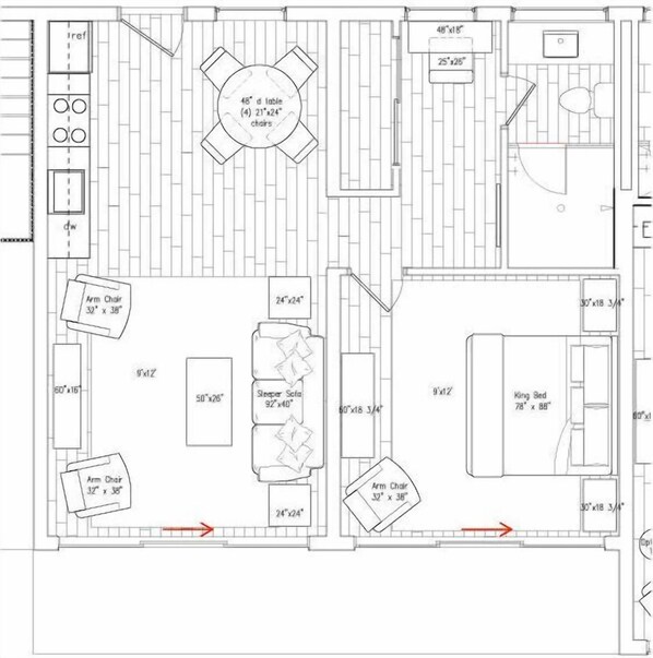 A floor plan of a hotel room with a king bed, two armchairs, a sofa, a dining table with four chairs, and a small bathroom.