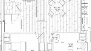 A floor plan of a hotel room with a king bed, armchairs, a dining table with chairs, a sofa, and a small bathroom. - Gulf View Suite 205 Apartment 1 (Holmes Beach)