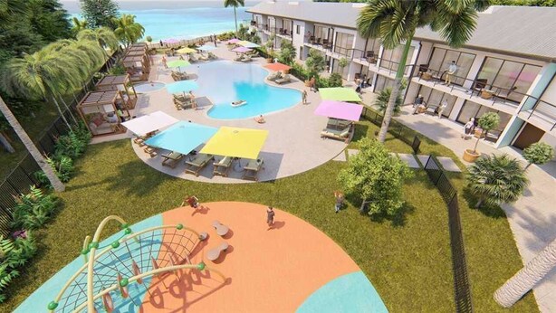Un complejo turístico con piscina, zona de estar al aire libre y parque infantil.