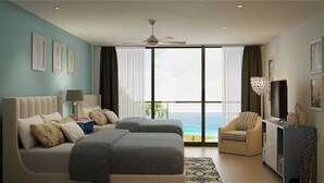 Habitación de hotel con cama, sofá, sillón, televisor y balcón con vista al mar.
