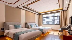 A hotel room with two beds, a TV, and a large window. - Zhouzhuang Yuesheng Hotel (Kunshan)