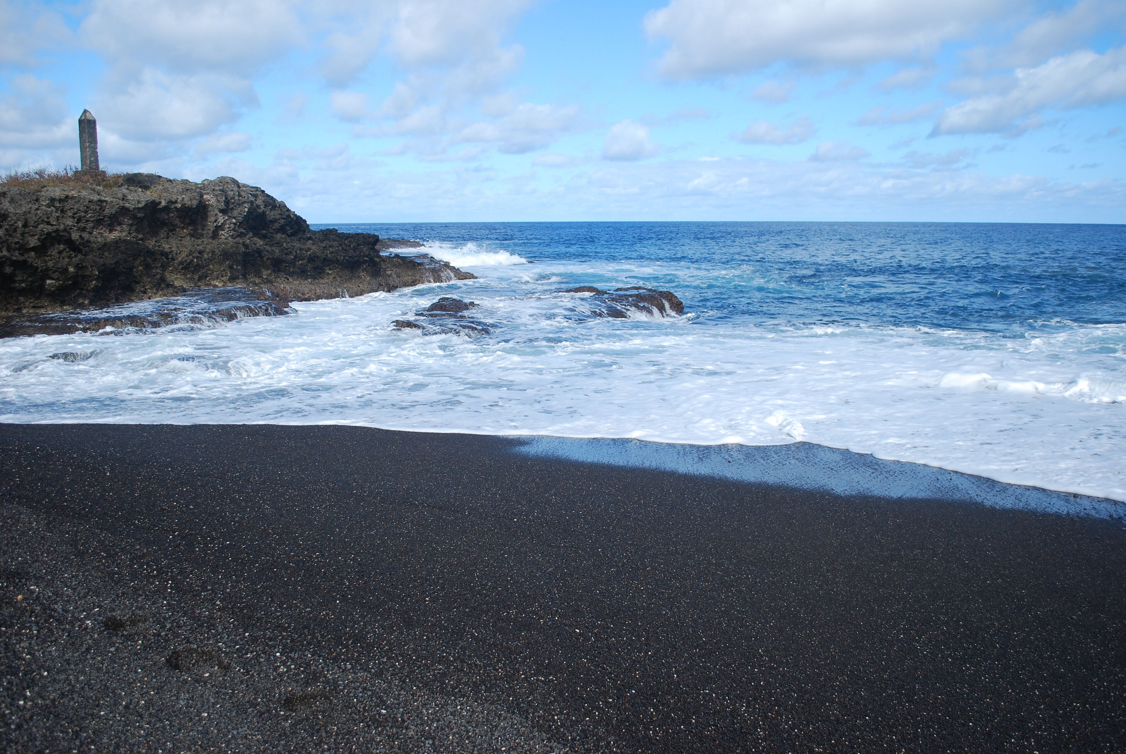 on the beach, black sand