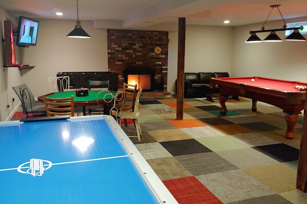 game room: flatscreen TV, fireplace, foosball, pool, poker, airhockey, boss toss